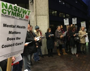 protesters sing about education cuts outside Swansea Council