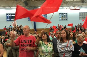Red flags flying at the Corbyn rally at LC2 leisure centre in Swansea